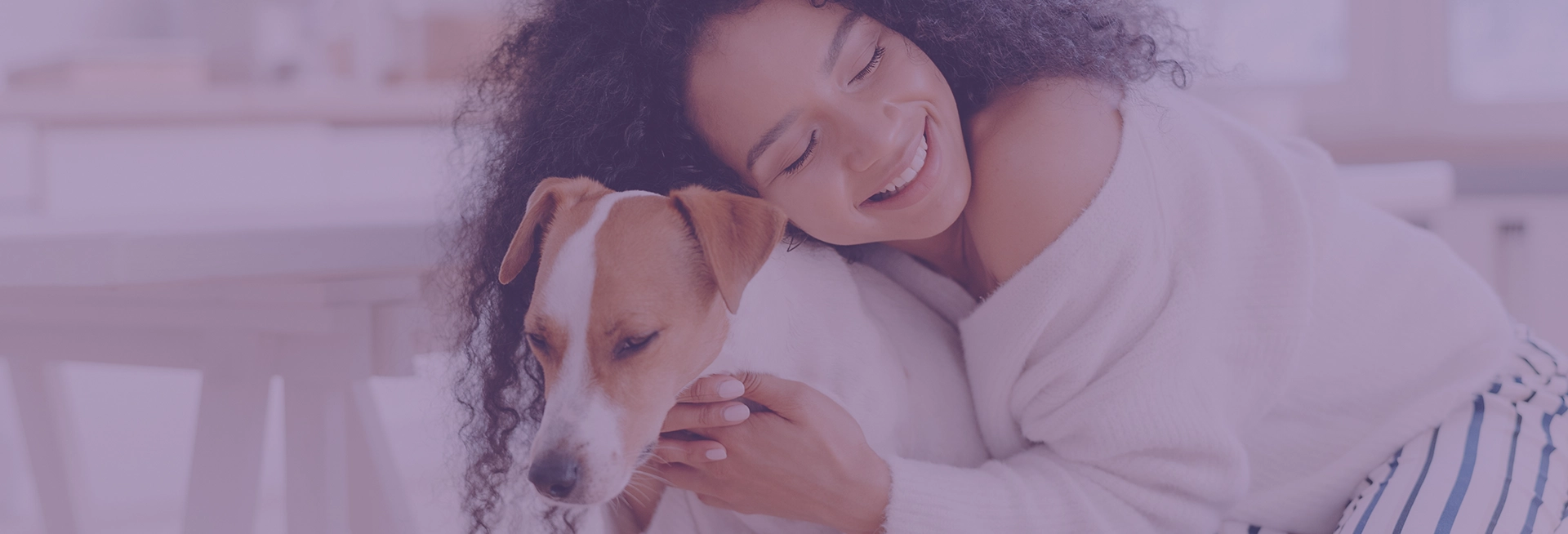 A girl hugging her dog